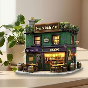 May include: A miniature model of Ivan's Irish Pub, featuring a green brick facade, a sign that reads "Ivan's Irish Pub", and the establishment year "Est. 1996". The model includes small tables, chairs, and barrels, with a lit interior.
