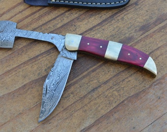 damascus handmade 2 blade folding knife with damascus blade stain olive wood handle and a fine leather sheath. 6089