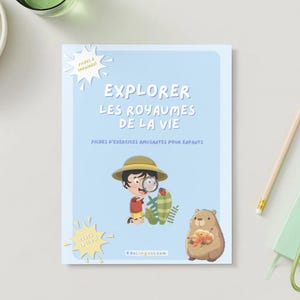 May include: A light blue workbook titled "EXPLORER LES ROYAUMES DE LA VIE" with illustrations of a child with a magnifying glass, a cactus, and a bear. A pencil, keys, and a small notebook are also visible.
