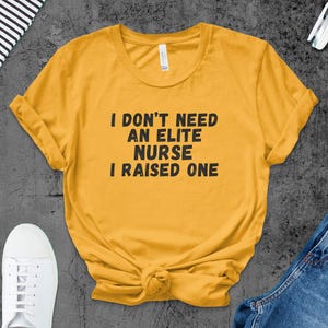 Raised An Elite Nurse T-Shirts, Proud Parent, Nursing Graduation, Gift For Mom, Nurse Gift, Funny Nurse Tee
