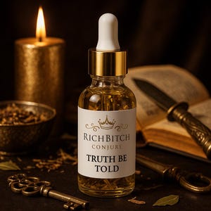 May include: A glass bottle with a white label reading "RICH BITCH CONJURE TRUTH BE TOLD" is the focal point. The bottle has a gold cap and a white dropper. A lit gold candle, a bowl, a key, and a knife are in the background.