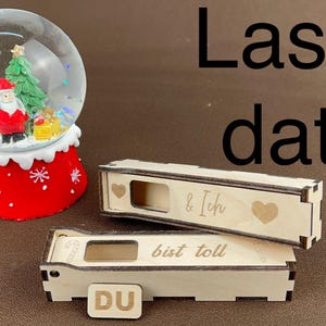 May include: Two wooden boxes with laser-cut designs. The top box has a heart and the text "& ich". The bottom box has the text "DU bist toll".