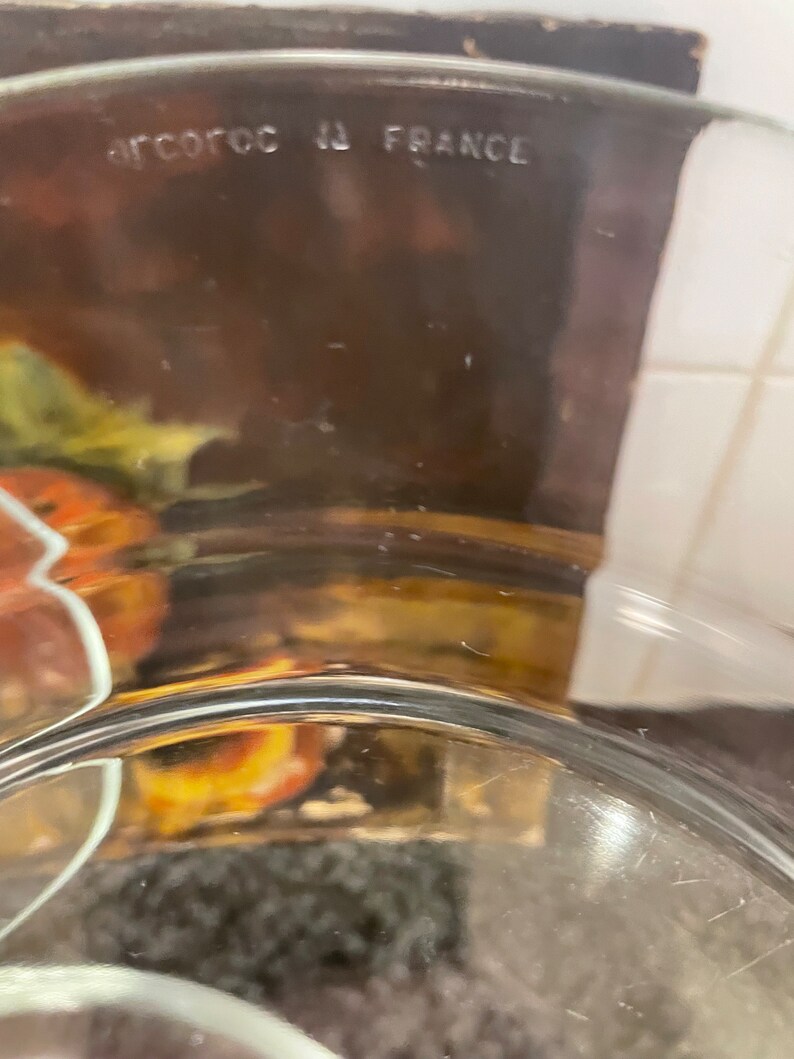 May include: A clear glass bowl with the text "ARCOCOC IN FRANCE" on the bottom.