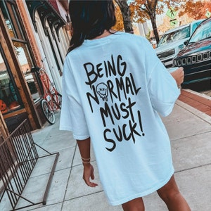 Normaal zijn moet een wit katoenen T-shirt zuigen
