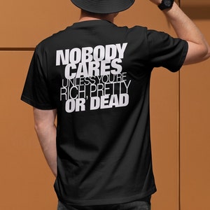 Niemand geeft erom grappig citaat zwart zwaar katoenen T-shirt