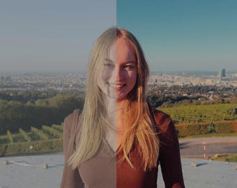 Puede incluir: Una mujer con el pelo largo y rubio está de pie frente a un horizonte urbano. Lleva un jersey marrón y mira a la cámara. El cielo es azul y el sol brilla.