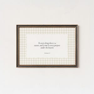 May include: Framed print with a brown frame, featuring a quote on a cream-colored background with a light green and white gingham pattern. The quote reads, "To every thing there is a season, and a time to every purpose under the heaven."