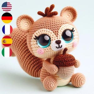 May include: A crocheted squirrel plush toy with large blue eyes, a brown nose, and a pink blush. The squirrel is holding a brown crocheted acorn.