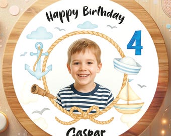 May include: A wooden birthday cake topper with a photo of a smiling child, surrounded by nautical-themed illustrations. The text "Happy Birthday" and "Caspar" are displayed, along with the number "4". The design includes an anchor, sailboat, and sailor hat.