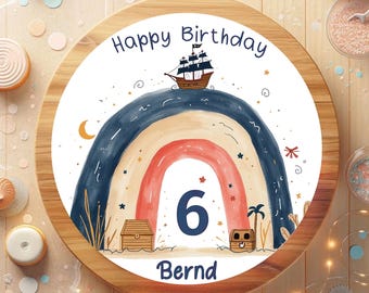 May include: A round wooden serving tray with a colorful birthday design. The design features a rainbow, a pirate ship, treasure chests, and the number 6. The words "Happy Birthday" and "Bernd" are also included.