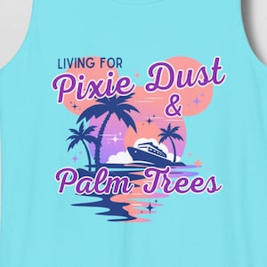 May include: A light blue tank top with a graphic featuring palm trees, a boat, and the text "Living for Pixie Dust & Palm Trees" in purple and white. The design includes a pink and orange sunset.