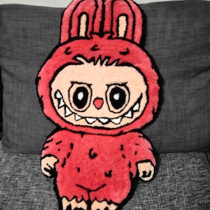 Tapis capitonné Labubu