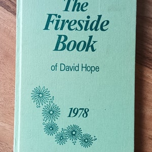 May include: A green book with the title "The Fireside Book of David Hope" and the year "1978" printed on the cover.