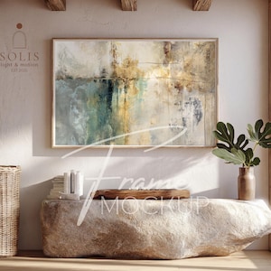 May include: An abstract painting in a wooden frame, featuring blues, golds, and browns, hangs above a stone bench. A woven basket and a vase with greenery are on either side. The text "SOLIS light & motion EST 2025" is visible.