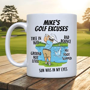 May include: White ceramic mug with the text "Mike's Golf Excuses" and a cartoon illustration of a golfer. The mug also lists common golf excuses such as "Tree in Way" and "Sun Was in My Eyes".