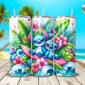 May include: A stainless steel tumbler with a colorful design featuring two blue Stitch characters from Lilo & Stitch riding a surfboard in a tropical setting with palm leaves, flowers, and ocean waves.