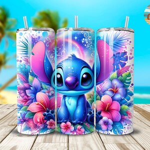 May include: A stainless steel tumbler with a colorful design featuring Stitch from Lilo & Stitch. The design includes tropical flowers and a galaxy background.