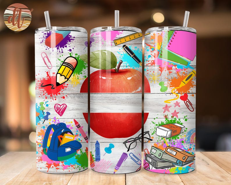 May include: Three colourful stainless steel tumblers with a back to school theme. The tumblers feature a red apple, a pencil, a backpack, and other school supplies. The tumblers are perfect for teachers, students, or anyone who loves school.