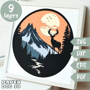 May include: A 9-layer papercraft design featuring a silhouette of a deer standing on a mountain peak with a full moon in the background. The design is in a circular frame with a sunset sky and a river flowing in the foreground. The design is labelled "Paper Dog 3D" and includes the file formats SVG, DXF, EPS, and PDF.