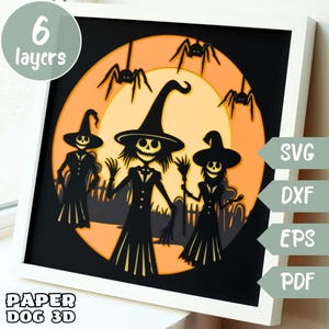 May include: A 6-layer papercraft design featuring three witches with pointed hats and broomsticks, standing in front of a large orange moon with black spiders. The design is labeled "SVG, DXF, EPS, PDF" and "Paper Dog 3D".