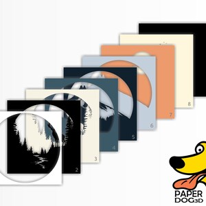 May include: Eight different colour variations of a papercraft design featuring a silhouette of a forest scene with a river and mountains. The design is in a circle shape and is numbered 1 through 8. The design is from Paper Dog 3D.
