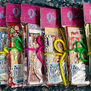 May include: A set of three ceramic mugs with a speckled, matte finish. The mugs are in shades of cream, light gray, and dark gray. Each mug has a simple, minimalist design, perfect for coffee or tea.