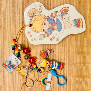 Chunky Rainbow Brite Junk Journal Charm/Bookmark. 80s Theme. Dangle. Bag Decor. Beaded Tassel. Planner Decor. Mixed Media Tassel.