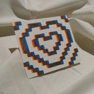 Carte coeur pixel illusion d'optique