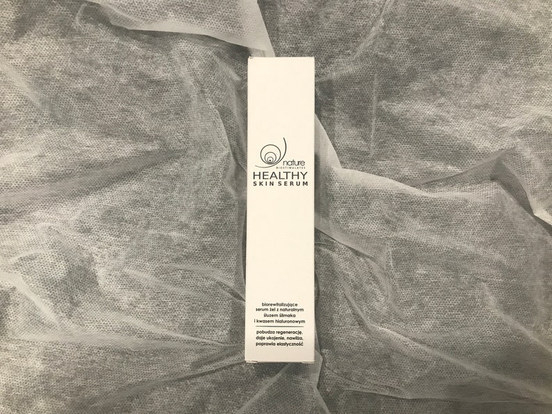May include: White box with black text that reads "nature biostimulates HEALTHY SKIN SERUM". The box also includes a description of the serum in Polish.