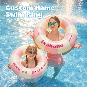 May include: Two inflatable swim rings featuring alternating light pink and white segments. One ring displays the name Isabella in pink text, while the other ring features the text Anna's 8th Birthday in pink. Both rings include two handles.