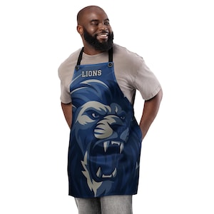 デトロイト ライオンズにインスパイアされたフットボールの試合日の衣装、スポーツファンへのギフト、テールゲート ファッションなどのエプロン。