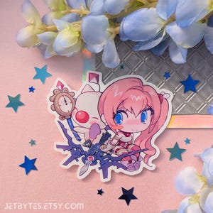 May include: A pink-haired anime character with blue eyes riding a blue and purple mechanical creature. The character is wearing a red and white outfit. The creature has a clock face on its head. The background is a pink and white surface with blue stars.