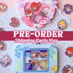 May include: A collection of colorful anime-style character charms and pins. The image features a pink heart-shaped display with character pins, and a blue game console-shaped display with character pins. The text "PRE-ORDER" is visible.