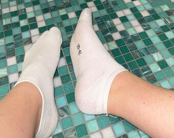 Einzigartige getragene Socken für sinnliche Momente"