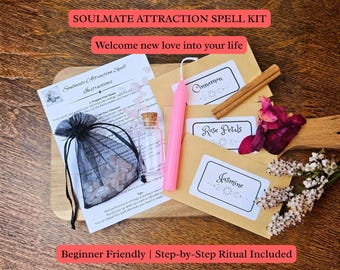 May include: A soulmate attraction spell kit containing a printed instruction sheet, a black organza bag with small pink stones, a clear glass vial with a cork, a pink taper candle, and three brown paper envelopes labeled Cinnamon, Rose Petals, and Jasmine.