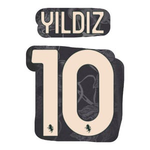 May include: A design featuring the name "YILDIZ" above the number "10". Both elements are cream-coloured and set against a dark background with a floral pattern. Small green accents are present.
