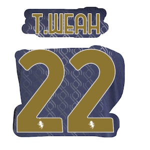 May include: A gold number 22 on a navy blue background with a gold name tag that reads "T. WEAH" above it.