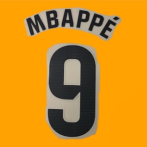 May include: White and black fabric jersey number 9 with the name "MBAPPE" above it.