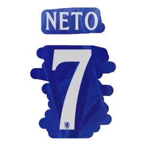 May include: A blue and white sports jersey patch with the name "NETO" above the number "7". The number is white and prominently displayed on a blue background. A small emblem is visible at the bottom.
