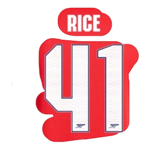 Peut inclure: Maillot rouge et blanc avec le numéro 41 et le mot "RICE" dans un ovale rouge au-dessus du numéro.