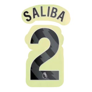 May include: A set of heat transfer numbers and name for a jersey. The name "SALIBA" is arched above the number "2". The number is black with a gray diagonal pattern and a Premier League logo at the bottom.