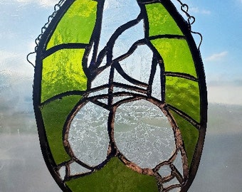 stained glass female form in green sun catcher