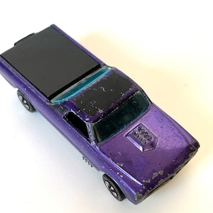 One of the original Sweet 16 Custom Fleetside 1967 Purple Redline Hong Kong, used, slight bend in the axles, rear plastic cover works