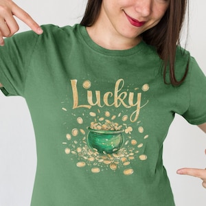 May include: Green t-shirt with a gold pot of gold and the word "Lucky" printed on it.