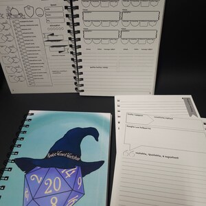 May include: A blue and purple notebook with a spiral binding. The cover features a cartoon illustration of a purple 20-sided die with a black wizard hat on top. The text "Rookie Wizard Workshop" is written on the hat. The notebook is labeled "Campaign Notebook".