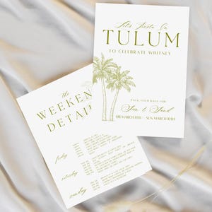 May include: Two white invitation cards with green text and illustrations. One card reads "Let's Fiesta In TULUM" with palm tree illustrations. The other card says "The Weekend Detail" with a schedule. The cards are on a white fabric.