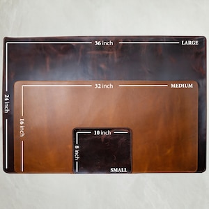 May include: Three leather desk mats in varying sizes: large (36 x 24 inches), medium (32 x 16 inches), and small (10 x 8 inches). The mats are brown with a distressed finish, showcasing a range of tones from dark to light.