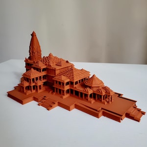 May include: A detailed 3D printed model of a Hindu temple, crafted in a terracotta orange colour. The model features intricate details and multiple levels, showcasing the architectural complexity of the temple.