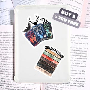May include: A set of stickers featuring book covers from the Grishaverse and Shadow and Bone series. The stickers are on a white background. The text on the stickers reads "Grishaverse", "Shadow and Bone", "Siege and Storm", "Ruin and Rising", "King of Scars", "Rule of Wolves", "Buy 2 = 3rd Free".