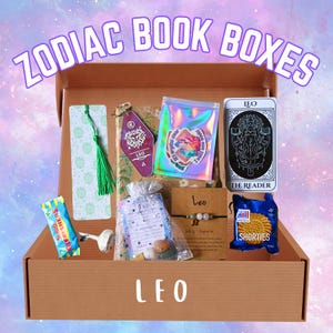 May include: A brown cardboard box filled with Leo-themed items. The box contains a bookmark, keychain, stickers, a tarot card, a bracelet, a bag of crystals, a snack, and a small bag. The text "ZODIAC BOOK BOXES" and "LEO" are visible.